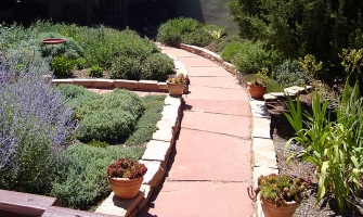 Flagstone path lined by chiseled rocks