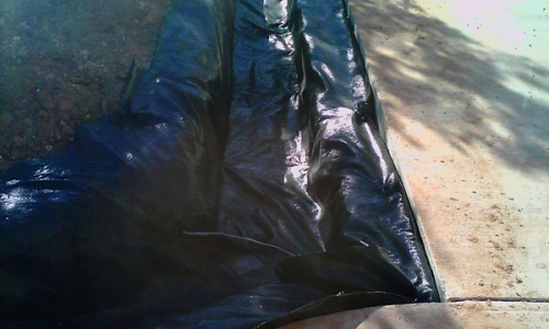 Pumice wick trench is lined with a geotextile fabric